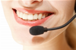 Person answering telephone with a huge smile